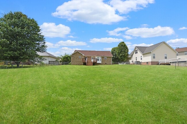 Building Photo - Pet Friendly Three Bedroom with Bonus!