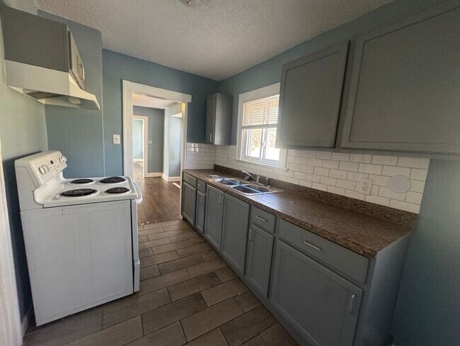 Building Photo - Charming 3BR 2BA Home w/ Fenced Yard + Covered Porch in KC