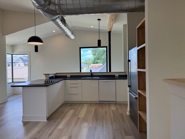 Building Photo - Vaulted Ceilings & Hardwood Floors in This Charming Indianapolis L
