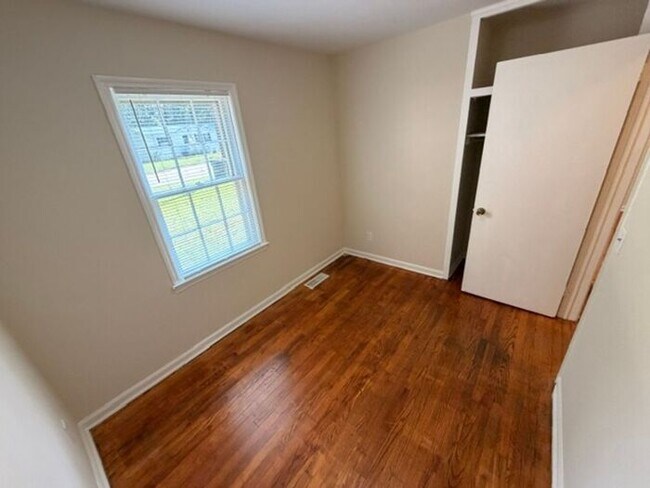 Building Photo - Three bedroom brick home available now!