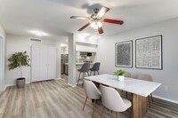 Enjoy meals in a bright and stylish dining area with modern finishes - Tribecca Pointe Apartments