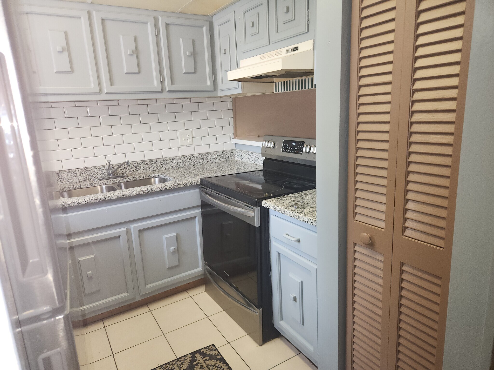 kitchen remodeled with granite counter tops and subway wall tiles. - 1836 N Crystal Lake Dr
