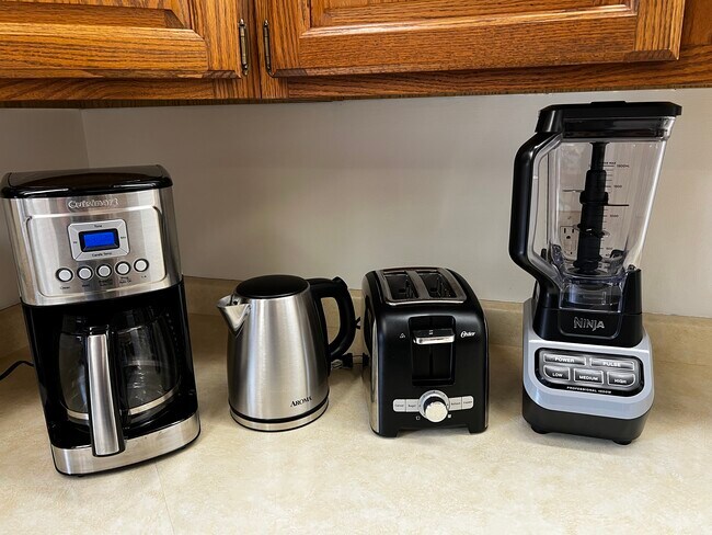 Brand new appliances include a coffee pot, electric kettle, toaster, and Ninja blender. - 228 W Lexington Blvd