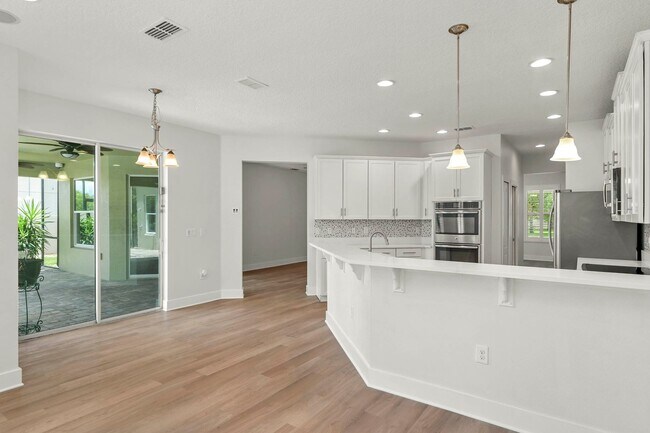 Building Photo - Expansive 4 bedroom, 3 bath remodeled home in gated community