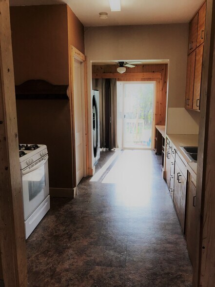 Kitchen includes stove and refrigerator - 924 E 1st St