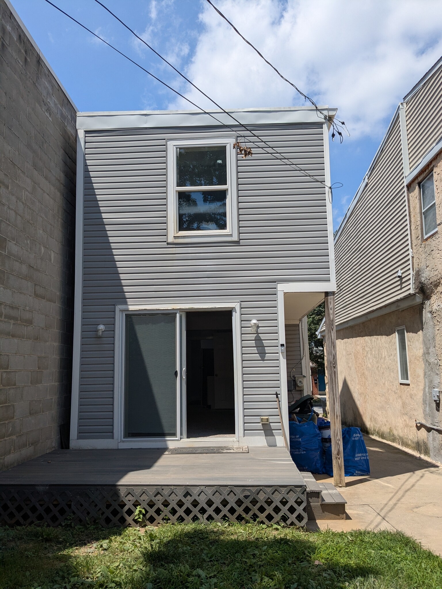Rear of building and sliding doors to the living room - 520 E Miner St