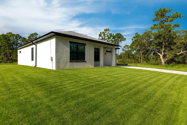 Building Photo - Brand New 4-Bedroom Gem with 2 Full Baths on Large Lot in Lehigh Acres – A Perfect Family Haven!