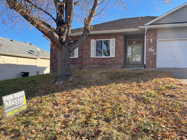 Building Photo - Northwest Omaha Gem: 2,700 Sq Ft, 3-Bedroom, Walk-Out Finished Basement, Fenced Yard, 3-Car Garag...