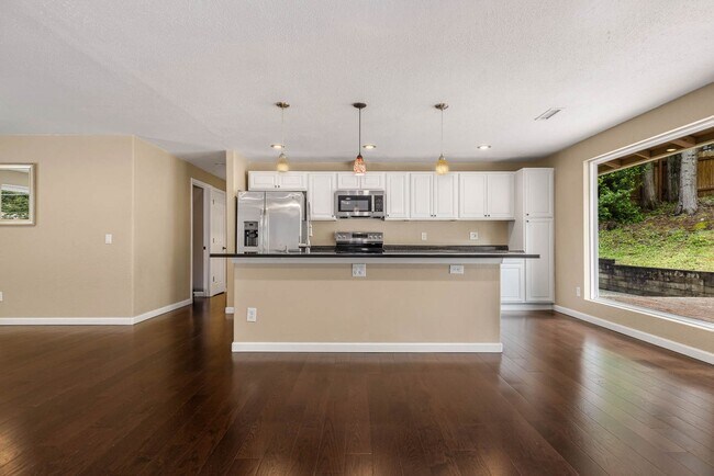 Building Photo - Updated Charmer with Open Kitchen, Private Yard & 2-Car Garage