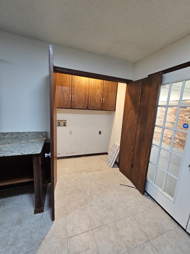 Washer/ Dryervhoodip laundry area with cabinets for storage - 2104 NW 118th Ter