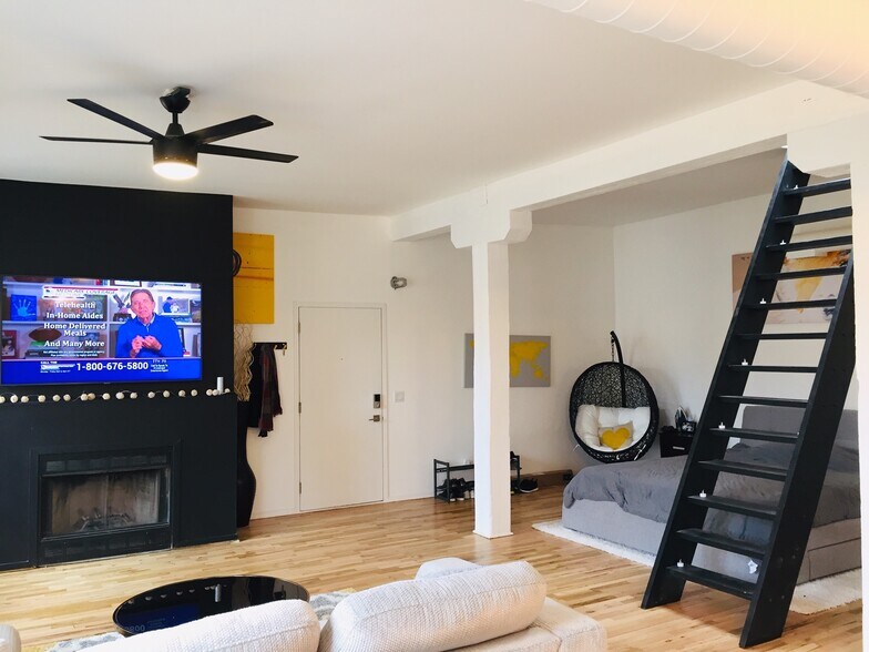 View into living room and open loft bedroom - 515 Noble N St