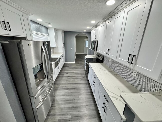 Building Photo - Fully-Updated 1st-Time Rental! Ready NOW! Pet Friendly w/Large, Detached Garage Workshop!