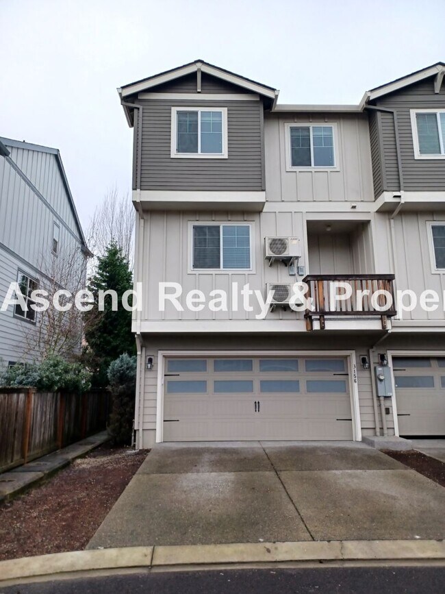 Building Photo - 3 Level End Unit Townhome with Newer Carpet, Open Floor Plan, 2 Balconies, 2 Car Attached Garage ...