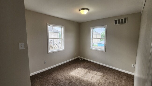 Building Photo - Corner 1st and 2nd flr. unit with central ...