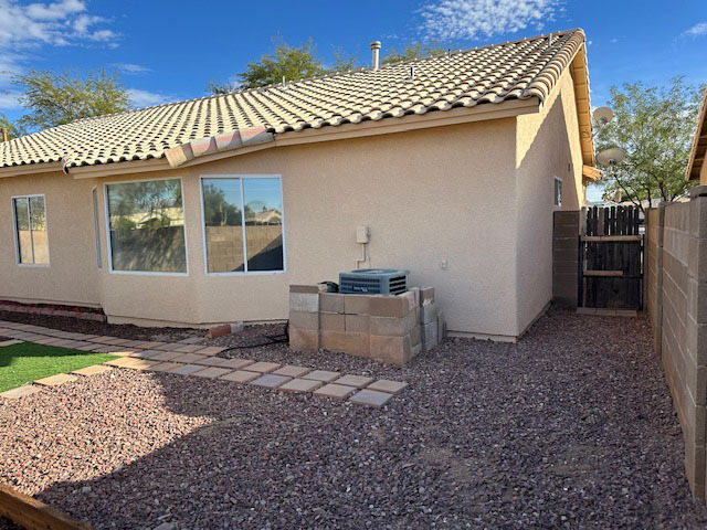 Aircon Unit and Side of yard - 7200 W Yarbough Dr