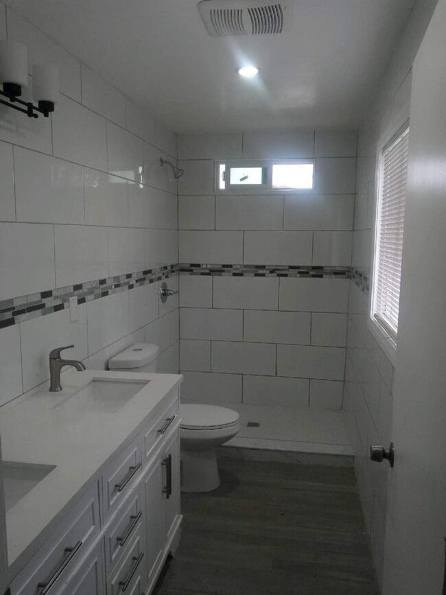 Building Photo - Welcome to 105th Homes, a thoughtfully des...