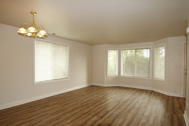 Front living area with bay window facing the front of the house. - 9624 Spencer Ct