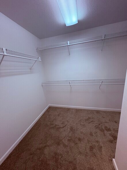 primary walk in closet - 2066 NW Yohn Ranch Drive