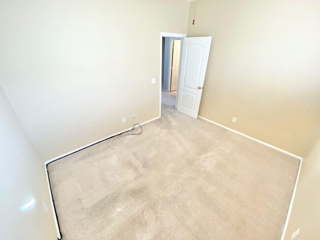 Building Photo - THIS SPACIOUS RESIDENCE FEATURES 4 BEDROOM...