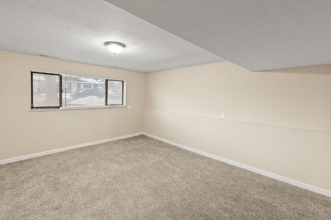 Building Photo - Spacious Split-Level Home with Finished Basement, Deck, Fenced Yard & 2-Car Garage