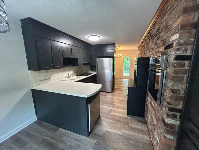 Building Photo - Spacious Multi-Level Brick Home