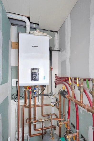 Mechanical system tankless - 214 Patchen Ave