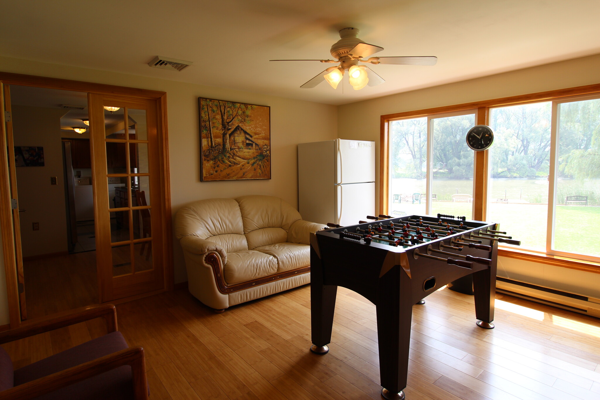 Living area (foosball table has been replaced with a dining table) - 2820 NY-28