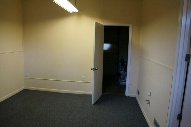 Laundry room with attached storage area - 749 Aeronca Rd NW