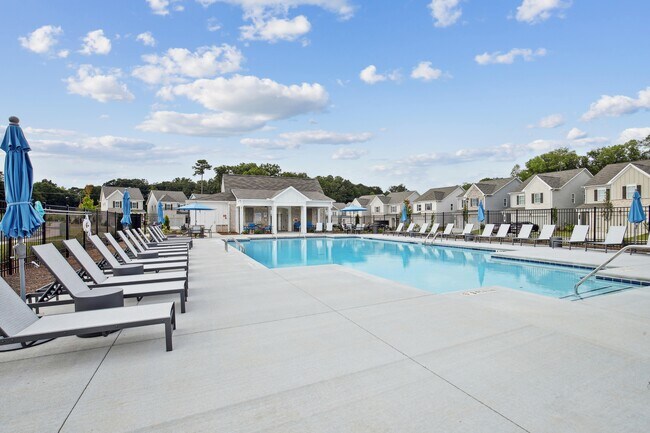 Luxurious poolside retreat with elegant seating. - West Oak Trace