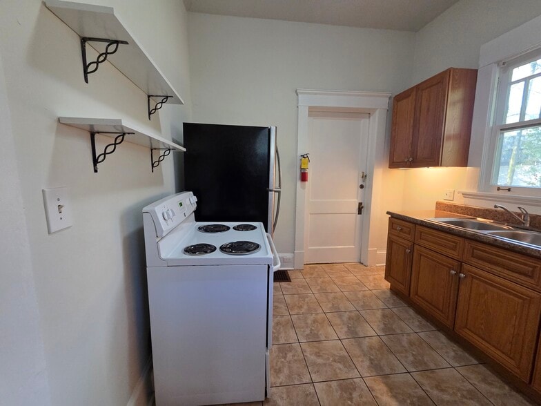 Kitchen with lots of cabinets and countertops - 974 N Highland Ave NE