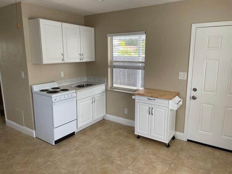 Kitchen w new microwave table/ utility table - 3815 1st Avenue North
