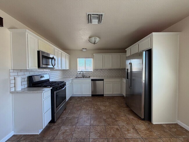 Building Photo - 3 Bedroom 2 Bathroom House with Central A/C , 2 Car Garage and Beautiful Backyard with Covered Patio