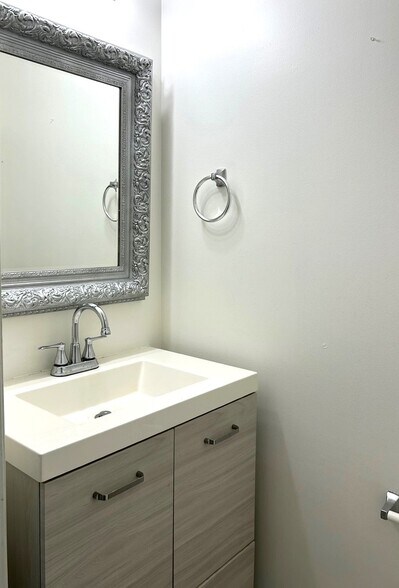 Updated powder room - 4505 Garden Club St