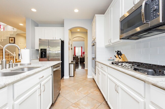 Building Photo - Stunning 4 bedroom 3.5 bath home with 3 ca...