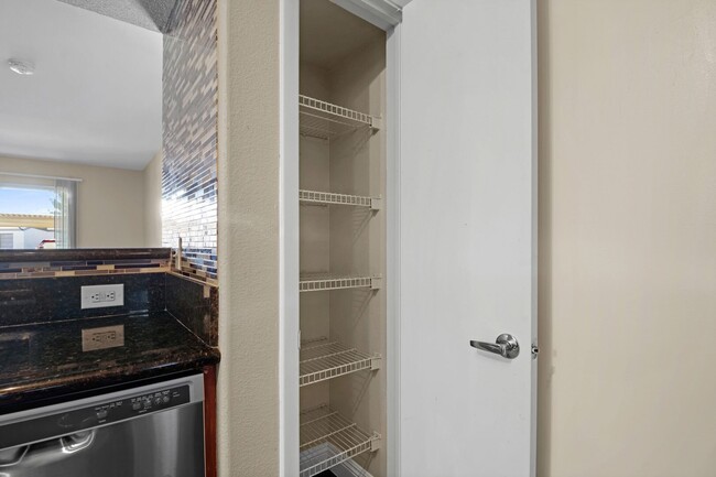 Building Photo - SE!!! Gated!! 1 Bedroom 1st Floor!! One Car Garage!!! Community Pool, Spa, Clubhouse!!! All tile ...