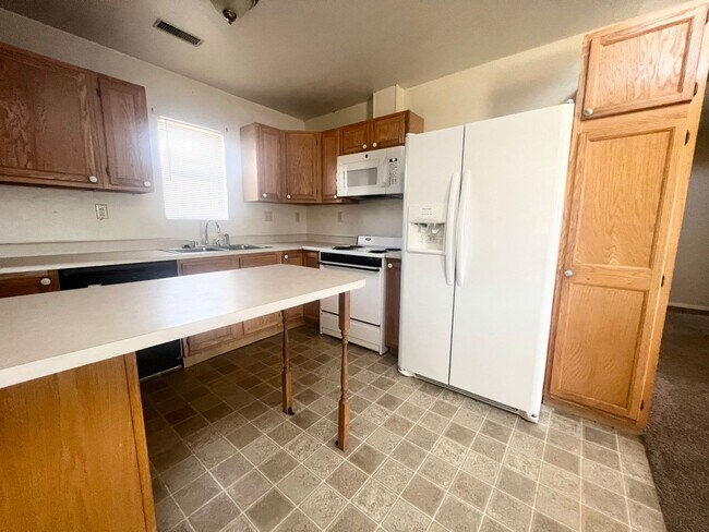 Building Photo - COMING APRIL 2026 - Affordable 2-Bedroom 1.5-Bathroom Home w/ Carport Parking!