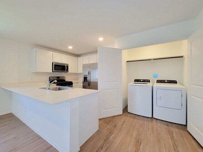 Building Photo - This single-story home has a comfortable layout with three bedrooms and a living area all on one ...