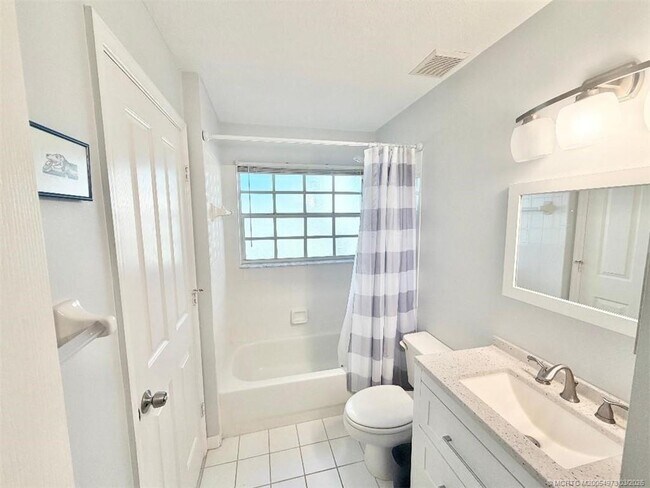 Building Photo - 3486 SW Pindo Palm Ln