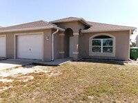 Building Photo - ONE MONTH FREE RENT!! SW Cape 3/2/1 Duplex Avail Now