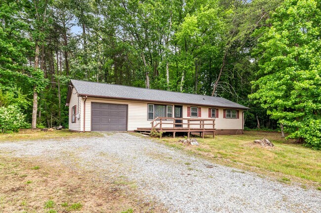 Building Photo - Updated Home, Stainless Steel Appliances, Wood Like Flooring, Deck, Garage!