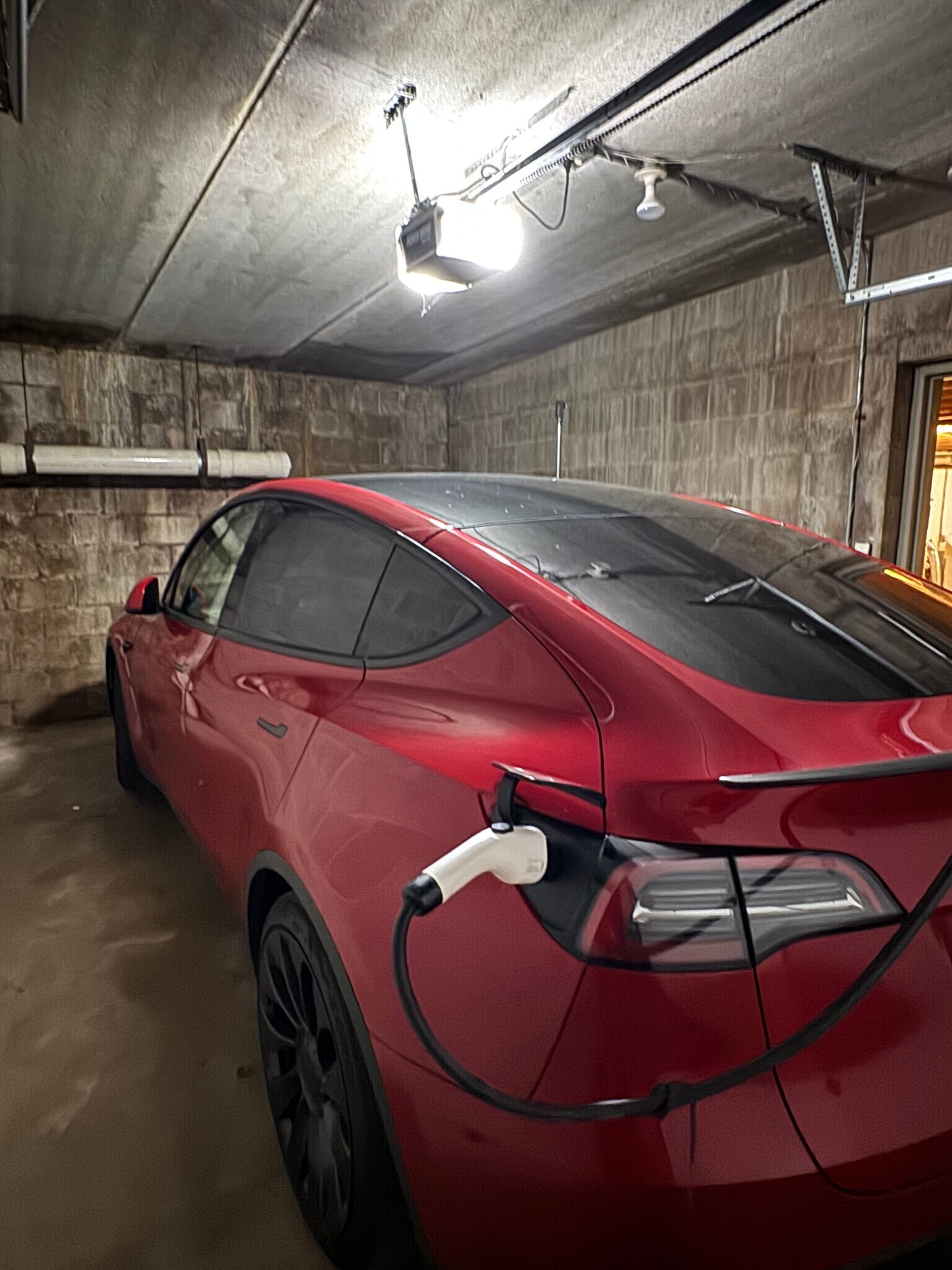 a private attached garage equipped with a Level 2 EV charger - 328 N Allen St