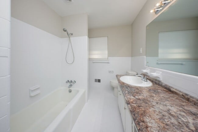 Building Photo - Newly renovated, spacious and versatile house waiting to be a home!