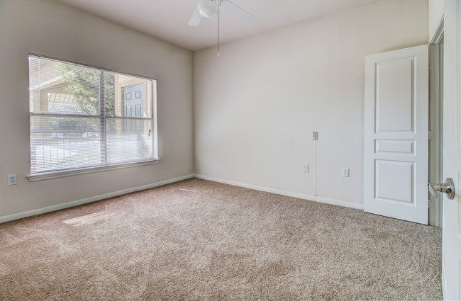 Bedroom with ceiling fan - Legacy on O'Connor Road