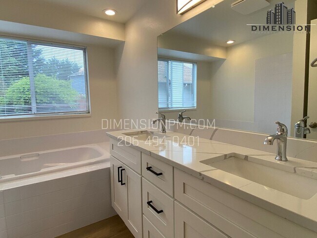 Building Photo - Stylishly Renovated Home with Private Back...