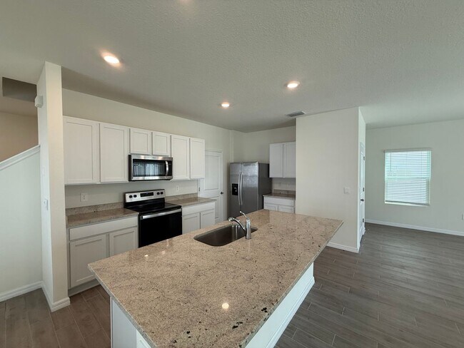 Building Photo - Spacious 4-Bedroom Modern Home in Oaks Preserve – Perfect Gainesville Location