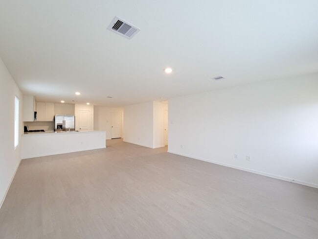 Building Photo - This lovely single-level home showcases a spacious open floorplan shared between the kitchen, din...