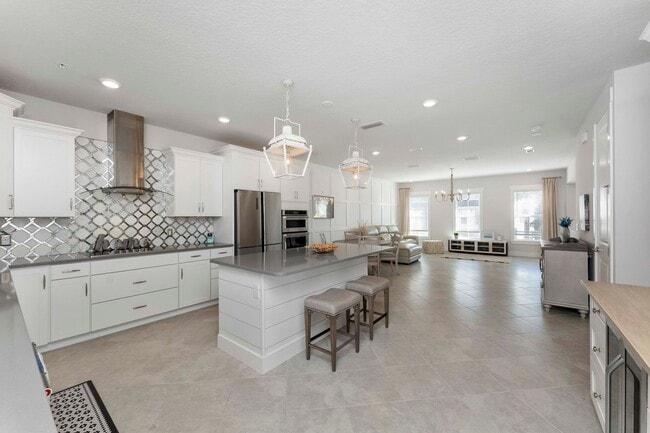 Building Photo - Introducing a captivating 3-story townhome...