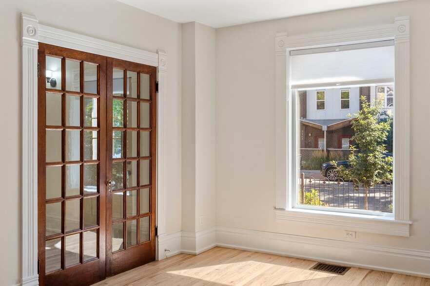 Double glass doors can be closed to separate spaces. - 3347 Tejon St