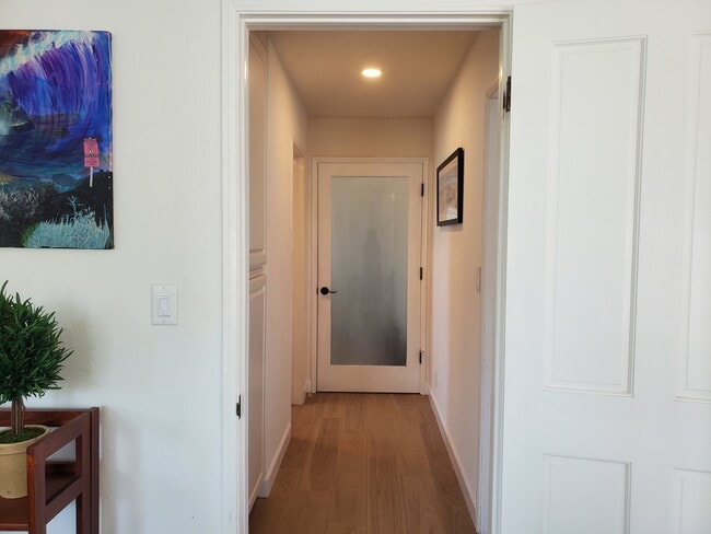 Hallway leads to bathroom, bedroom and linen closet - 301 N Francisca Ave