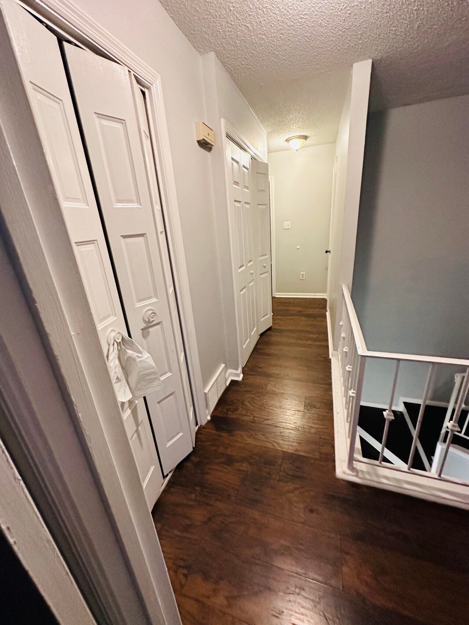 upstairs hallway with hall laundry - 3637 Haughton Ln